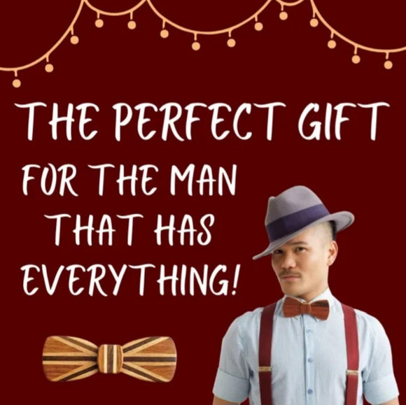 A man wearing a wooden bow tie with the words The Perfect Gift for the man that has everything!