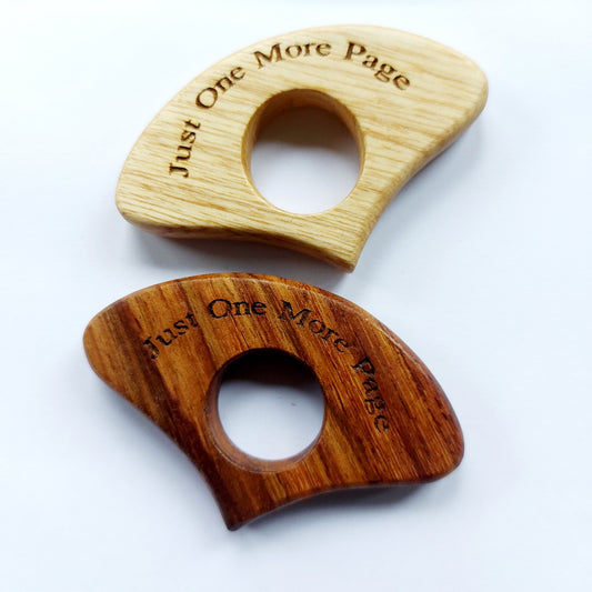 Wooden page holders engraved with Just One More Page