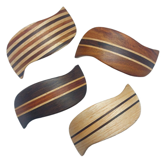 Four curved wooden decorative pieces with striped grain patterns in light, medium, and dark wood tones, arranged on a plain white background.