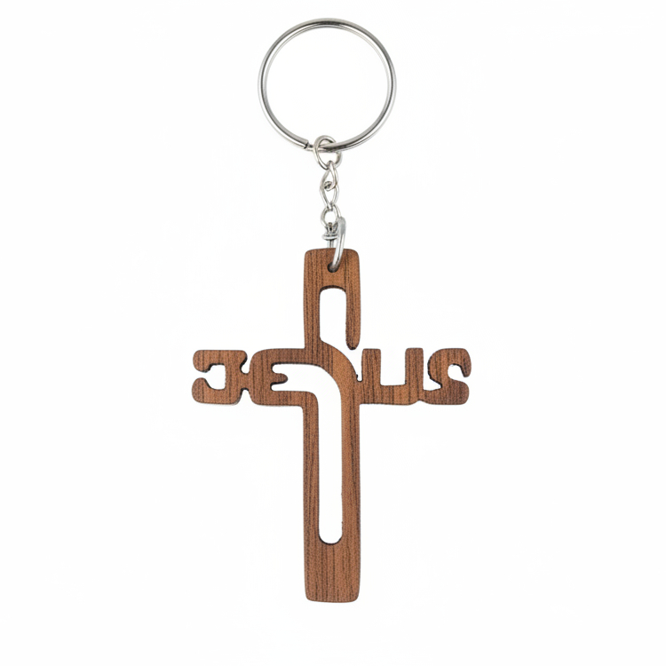 A wooden cross keychain with the word 'JESUS' cut out of the cross and a silver metal key ring and chain, shown on a plain white background.