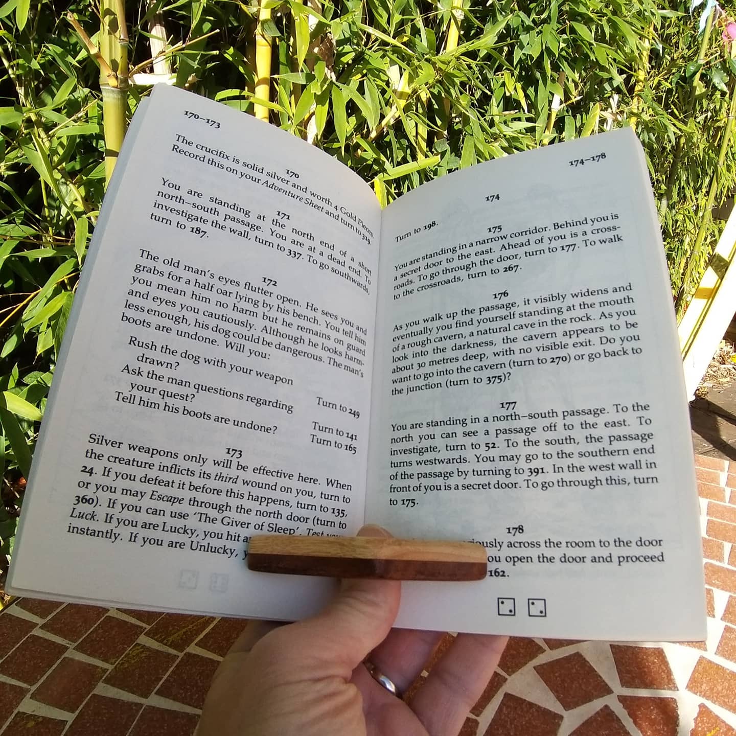 two tone wooden page holder being used with a book 