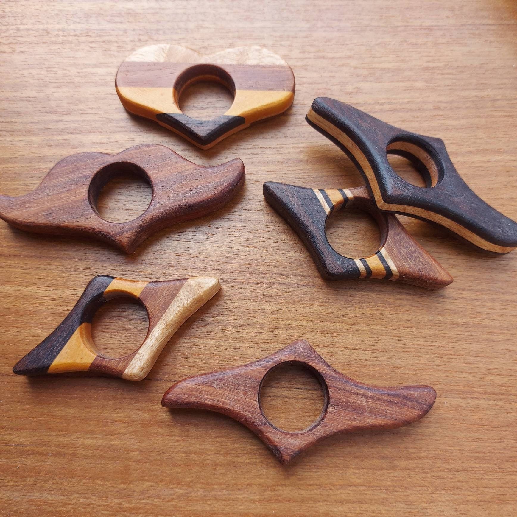 Collage of handmade wooden book page holders — reclaimed wood, holds book open hands-free