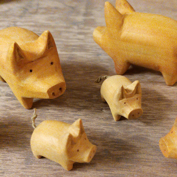 Hand carved little wooden pig. Natural yellow wood