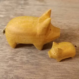 Hand carved little wooden pig. Natural yellow wood
